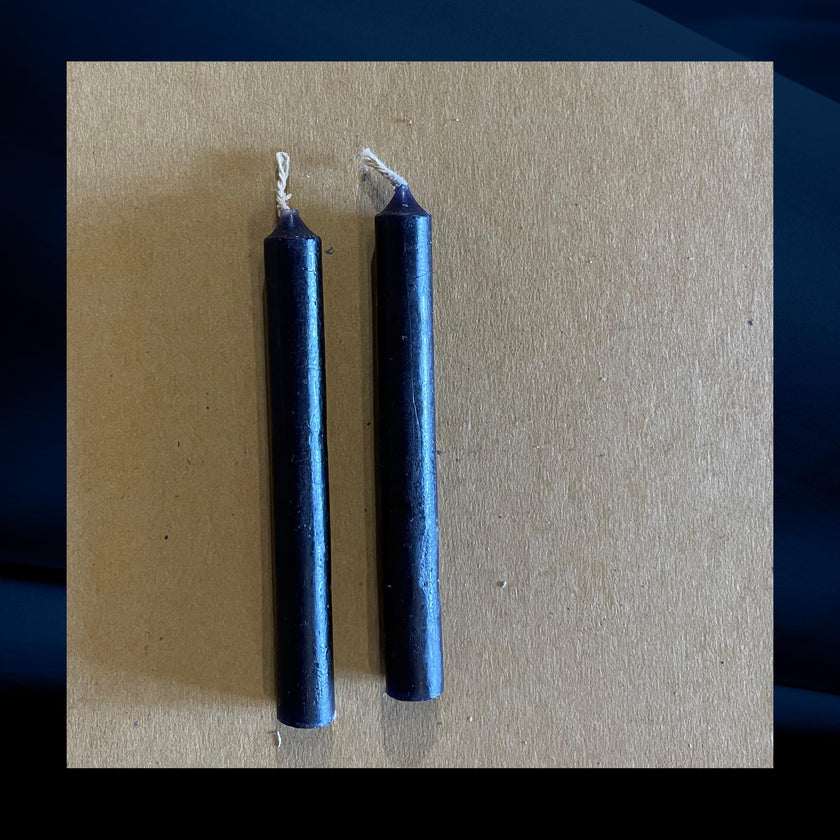 Two black chime candles