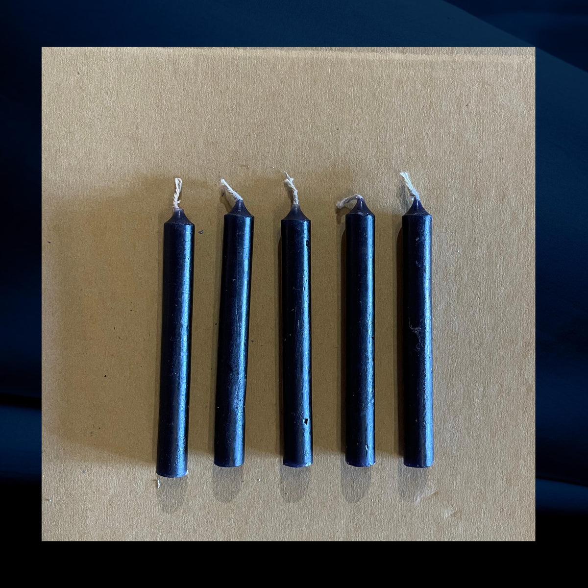 Five black chime mini candles